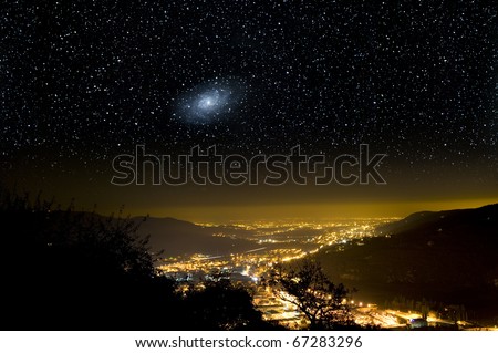 The Universe above city lights. The Triangulum galaxy, M33.