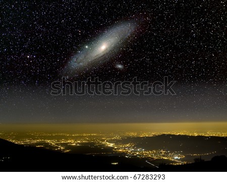 The Universe above city lights. The Andromeda galaxy.