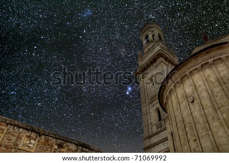 The glory of God\'s Universe. The night sky above an Italian church.