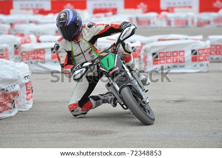 VERONA, ITALY - JANUARY 21: Unidentified mini-motorbike rider on January 21, 2011 in Verona, Italy. Part of the annual Motor Bike Expo, an event that attracts enthusiasts from all over Europe.