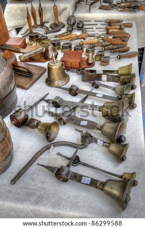 Antique bells at a market stall. High dynamic range image.