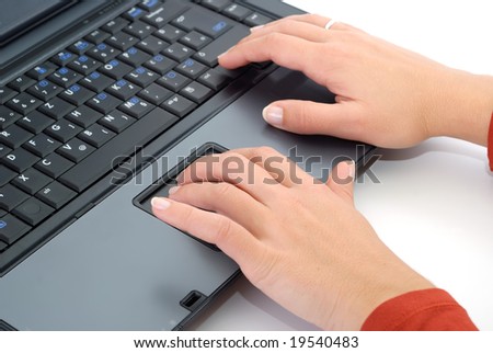 Woman hand typing at laptop, isolated on white