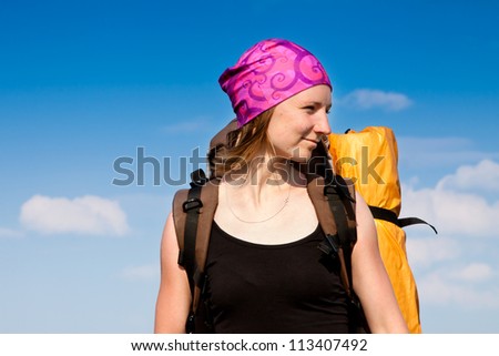 Hiker portrait. Female hiking woman happy and smiling during hike trek