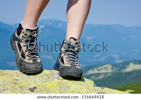 hiking boots on the rock in the mountains