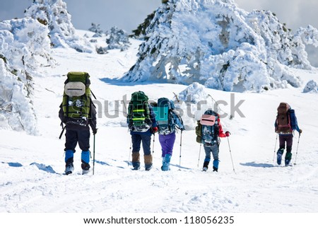hikers in winter mountains