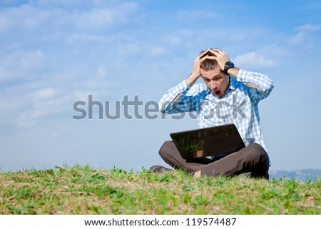 Oh. No! man with laptop working outdoor