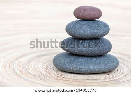 Stone tower on a wooden board