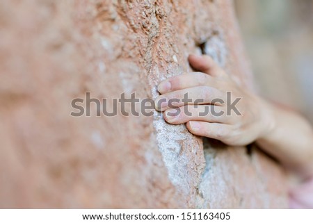 Rock climber's hand on handhold