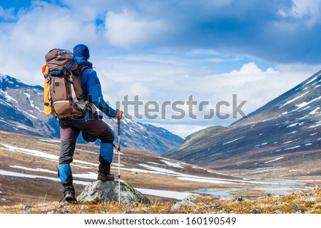 Tourist With A Backpack And Mountain Panorama