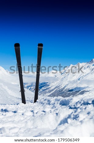 Pair of cross skis in snow. Winter vacations