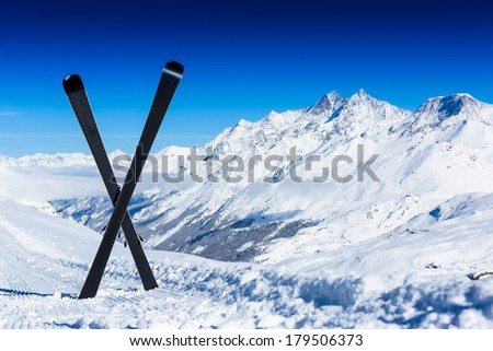 Pair of cross skis in snow. Winter vacations