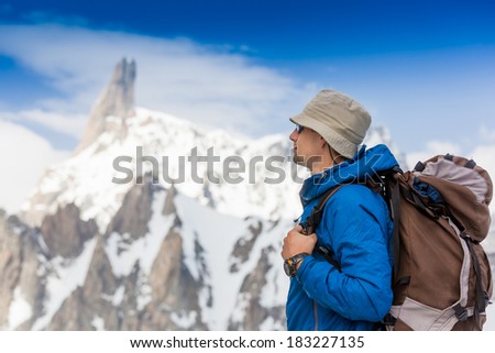 close up portrait of hiker looking at the horizon in the mountains