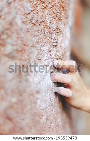 Rock climber\'s hand on handhold