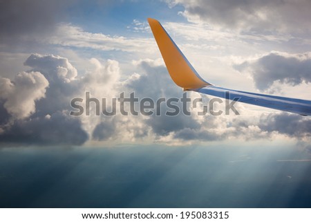 Wing of an airplane in the sunlights
