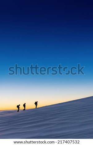 Hiker\'s silhouettes by the break of day