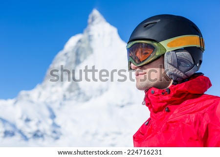 Young skier ready for a new day on the ski slopes. Italian Alps. Matterhorn