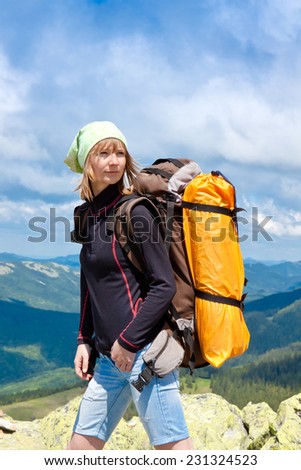 close up portrait of hiker looking at the horizon in the mountains