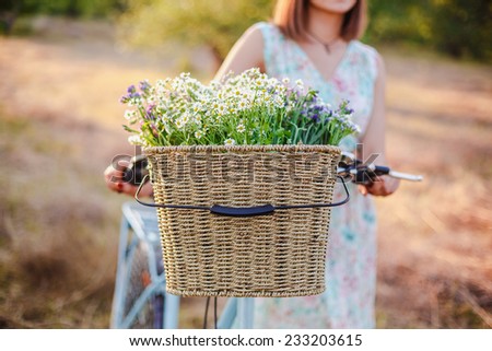 Bicycle with wicker basket and flowers