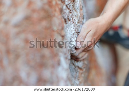 Rock climber\'s hand on handhold