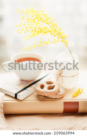 book cover with spring flower and tea cup. Spring inspiration