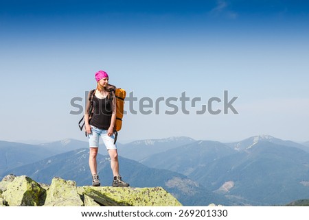 Female happy hiking woman during a hike