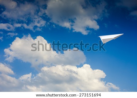 Paper plane against sky with clouds