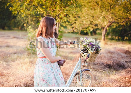 beautiful beautiful girl with a vintage bike in the parkgirl with a vintage bike in the park