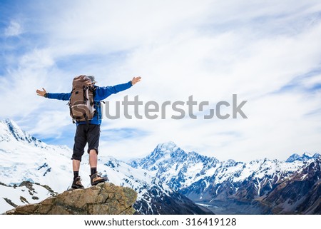 Hiker on the mountain top. Sport and active life concept. New Zealand. Mountain Cook