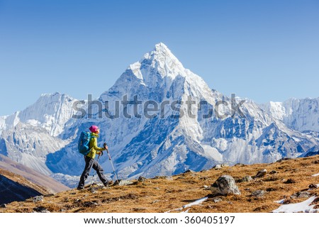 Happy hiker walking in the mountains, freedom and happiness, achievement in mountains. Himalayas, Everest Base Camp trek, Nepal