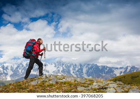 Hiker trekking in the mountains. Sport and active life