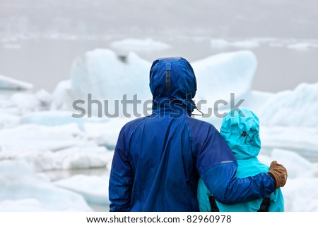 Young happy couple looking at view during hike in Iceland