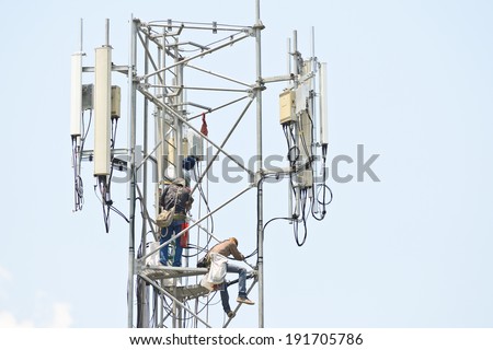 Technician working on communication towers