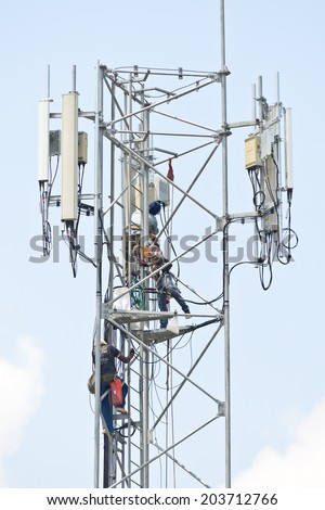 Technician working on communication towers