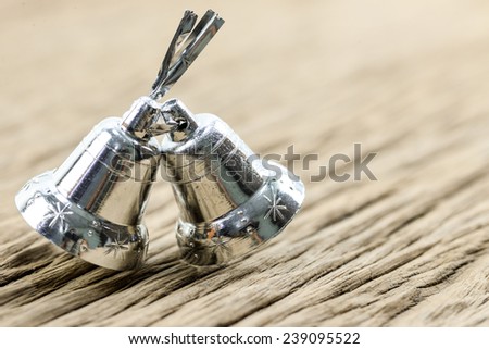 silver bell on wood background