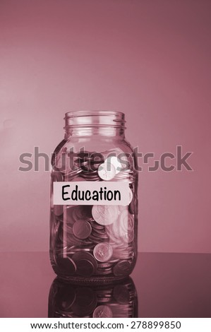 Saving Concept: Coins in money jar