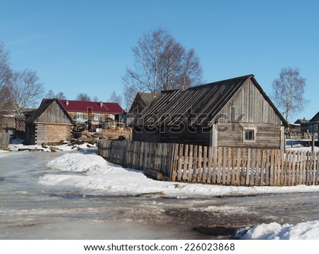 Wooden house in winter village