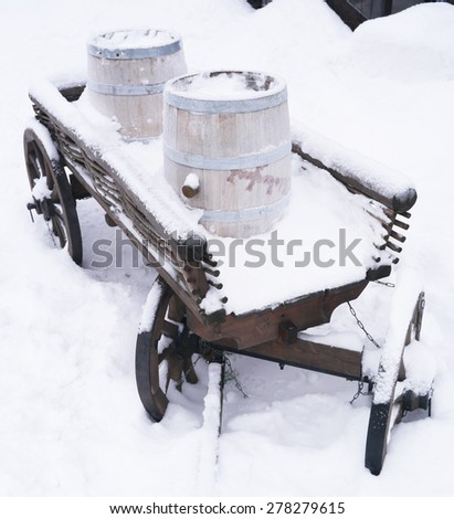 dray horse with barrels in the snow