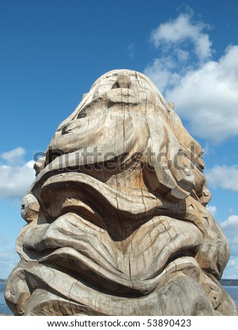 PETROZAVODSK - APRIL 1: A wooden sculpture figure on quay of Onega , April 1, 2009 in Petrozavodsk, Russia. Sculptures on quay of Petrozavodsk one of the most beautiful in the world.
