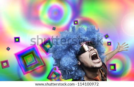 Crazy guy with blue wig on colorful background