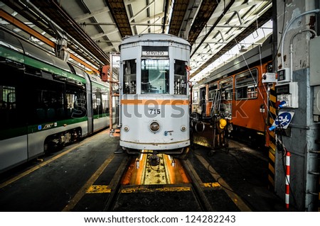 MILAN, ITALY - APRIL 19: People visit ATM magazine in Milan April 19, 2010. One time a year people can visit magazine garage of public transport company of Milan where there are old and new vehicles