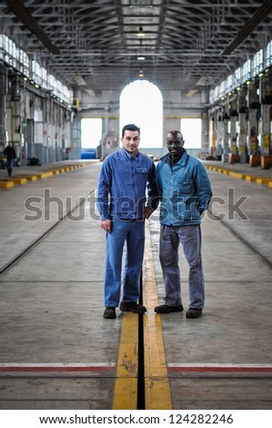 MILAN, ITALY - APRIL 19: Workers of ATM magazine in Milan April 19, 2010. One time a year people can visit magazine garage of public transport company of Milan where there are old and new vehicles