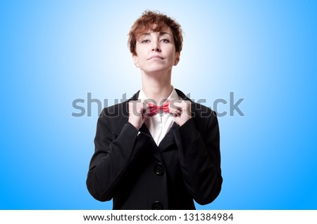 elegant woman with red bow tie on blue background