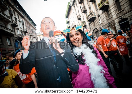 MILAN, ITALY - JUNE 29: Gay Pride Parade & Celebration in Milan June 29, 2013. Participants take to the street for their rights organizing a street parade party