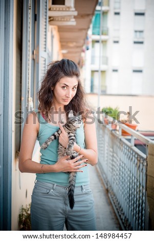 beautiful woman with cats at home