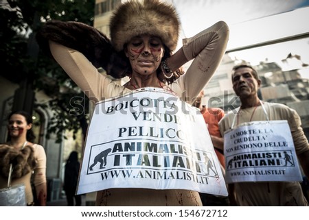 MILAN, ITALY - SEPTEMBER 17: Animalisti Italiani protest on September 17, 2013. Animal right association \'Animalisti Italiani\' protest against furs and fashion, in famous Milan street Monte Napoleone