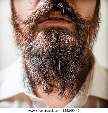 Close Up Of Long Beard And Mustache Man With White Shirt