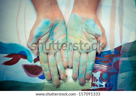 colorful painted hands on colored background