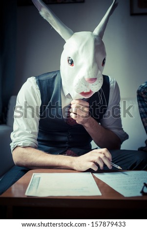 rabbit mask man and woman working at home