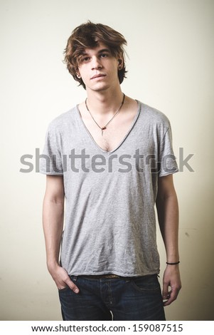 stylish young blonde hipster man on white background