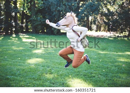 Young Hipster Horse Mask Woman In The Woodland Autumn